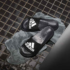 Adilette_Shower_Slides_Black_F34770_HM1_hover