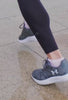 Walking in grey trainers